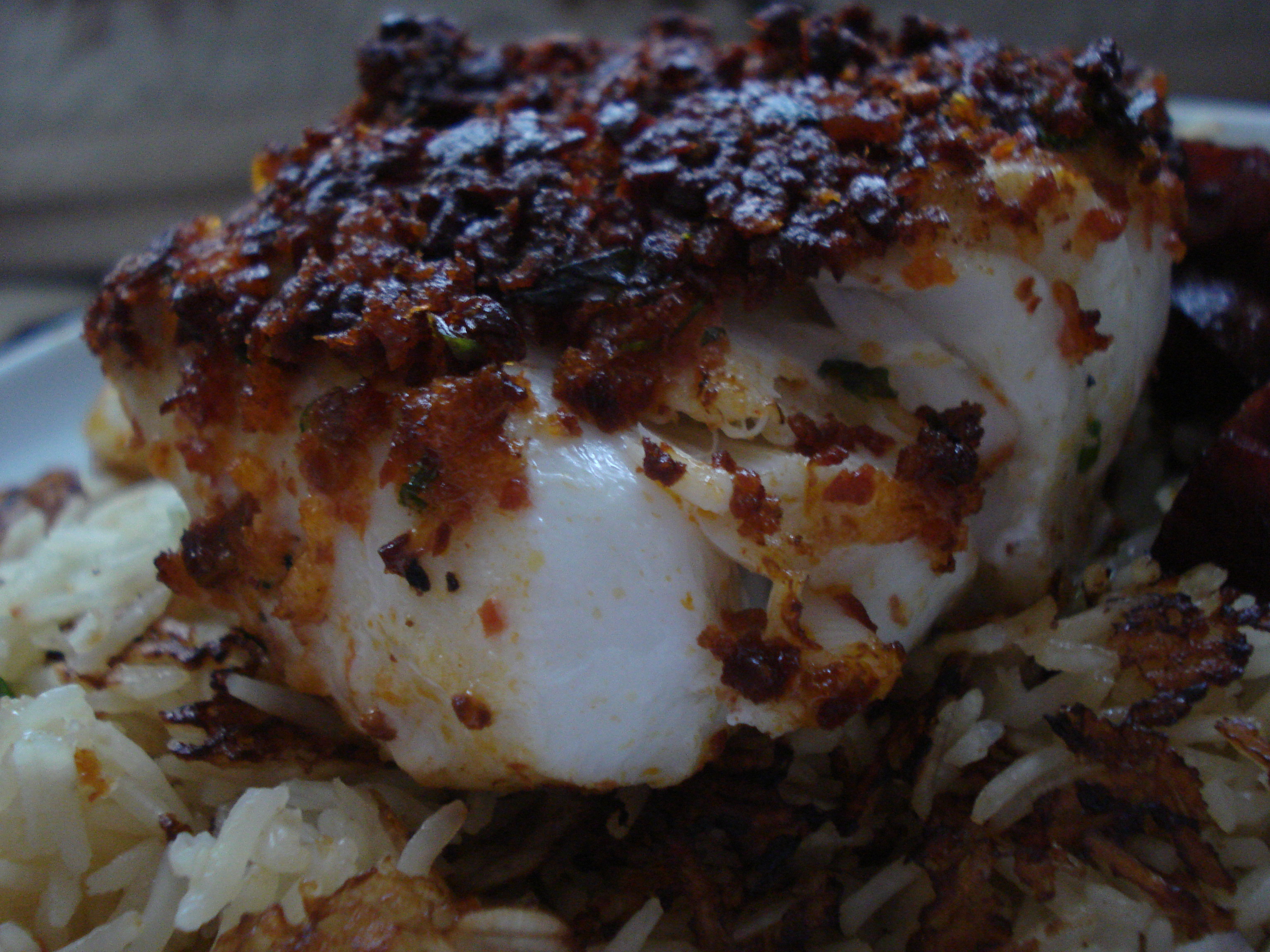 cod with a chorizo crust served with rice