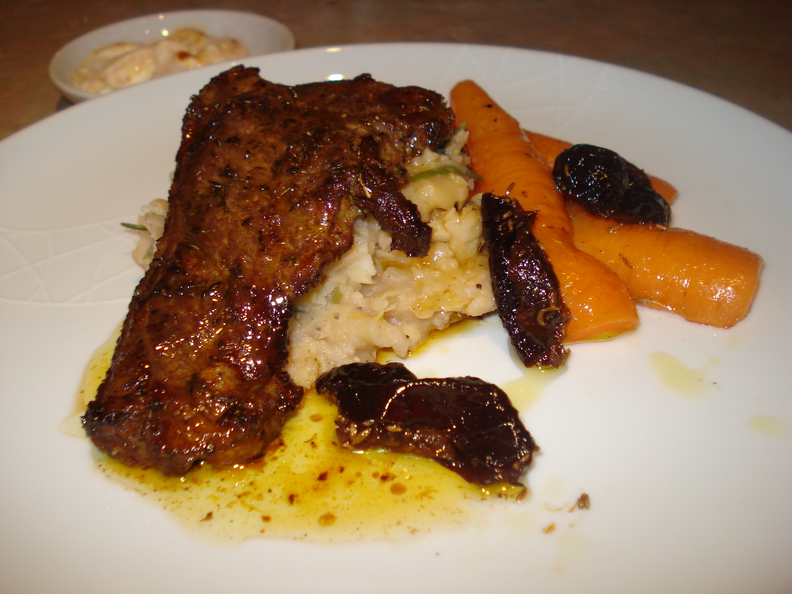 spicy lamb steaks with garlic butter bean mash and roast carrots