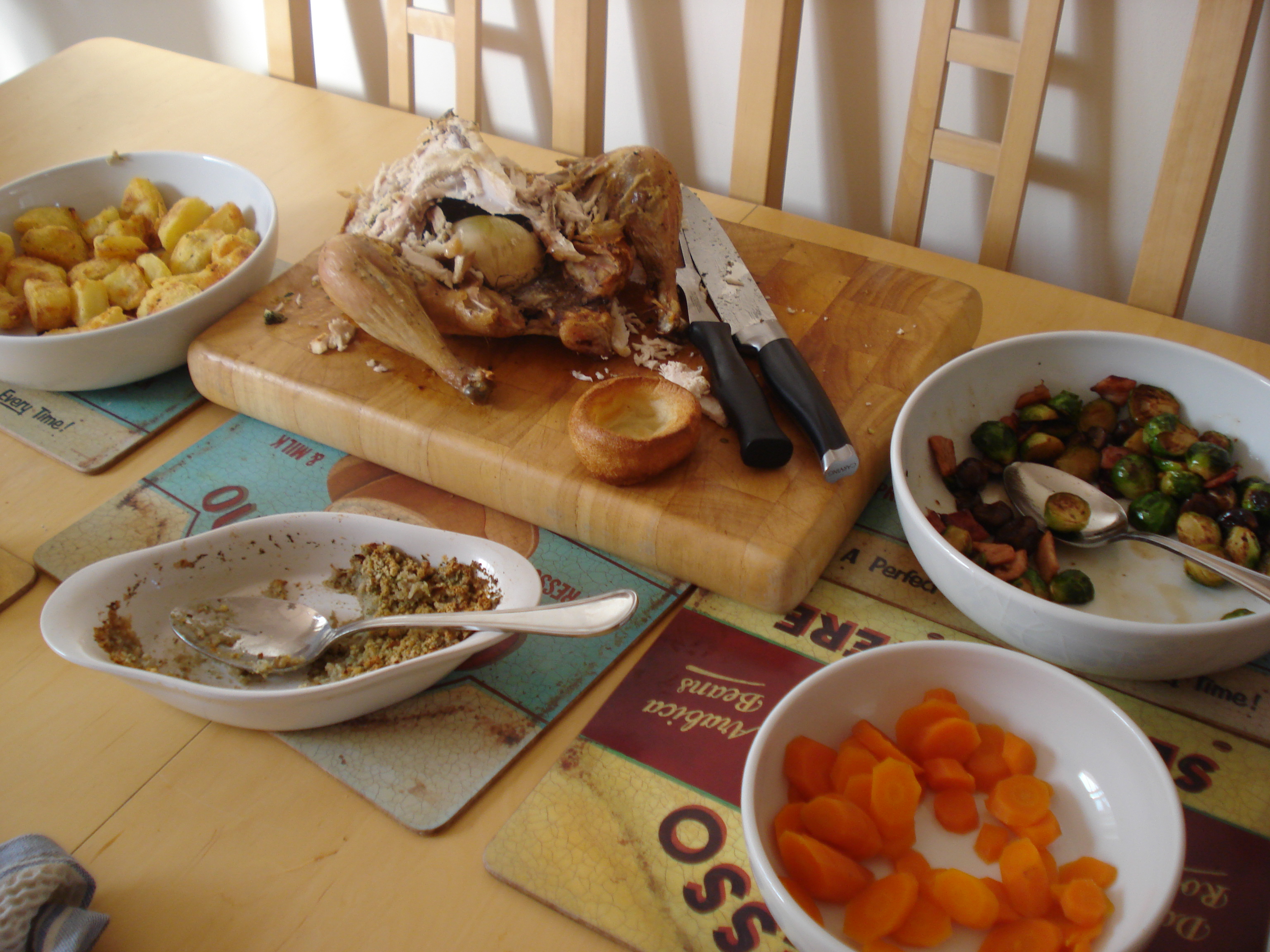 sunday roast chicken with roast potatoes, carrots and brussels sprouts