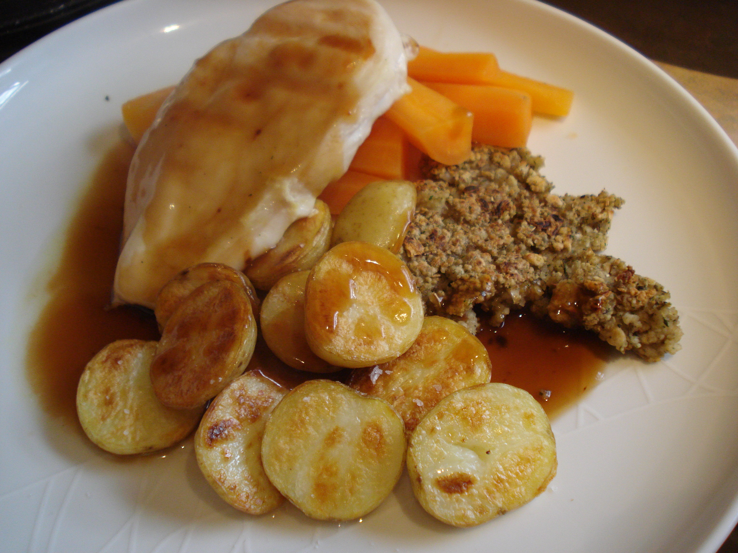 grilled chicken, roast potatoes, stuffing, carrots and gravy