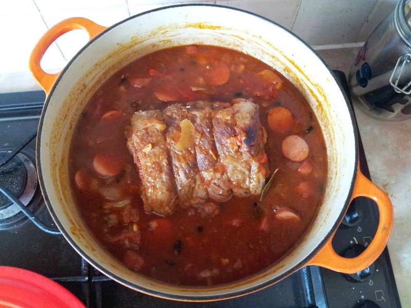 beef brisket simmering in feijoada