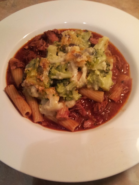 pork and lamb ragu topped with broccoli cheese